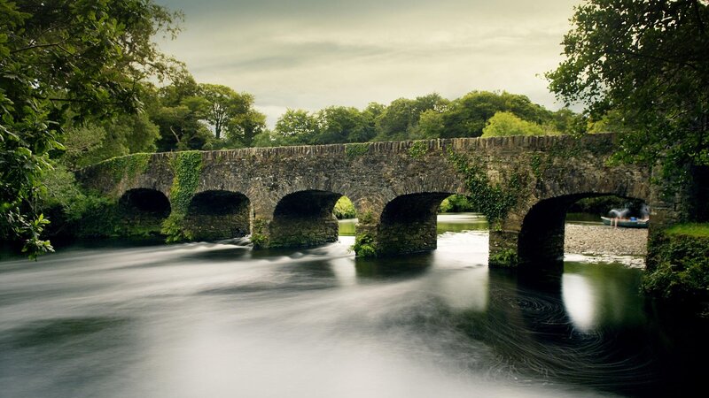 Stone Bridge over River — Green, Serene, Afternoon, Photograph, Trees, Boat