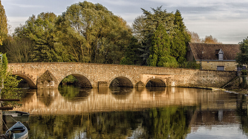 Stone Bridge over River — Green, Serene, Afternoon, Photograph, Trees, Building, Boat