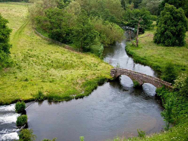 Stone Bridge over River — Green, Serene, Afternoon, Photograph, Trees, Fence