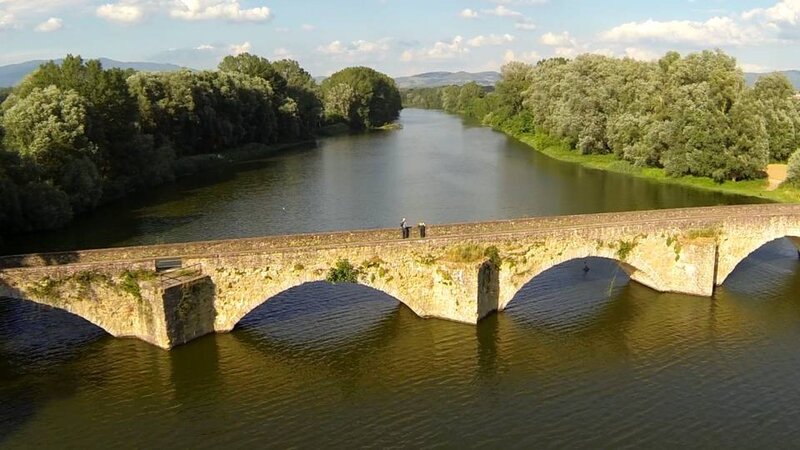Stone Bridge over River — Green, Serene, Afternoon, Photograph, Trees, People