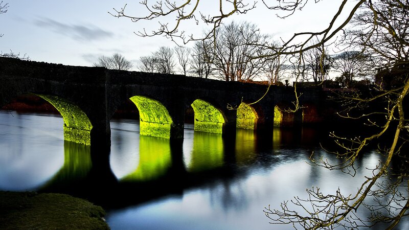 Stone Bridge over River — Green, Serene, Night