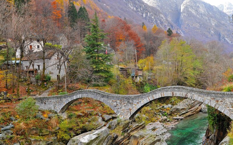 Stone bridge over river in autumn