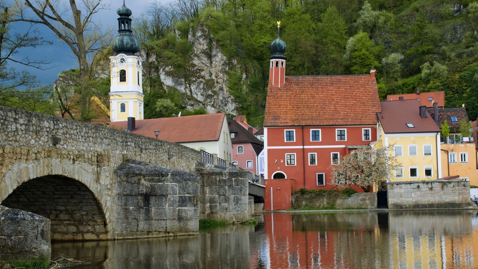 Stone bridge over river in German town