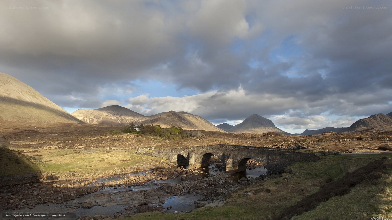 Stone bridge over river in mountains