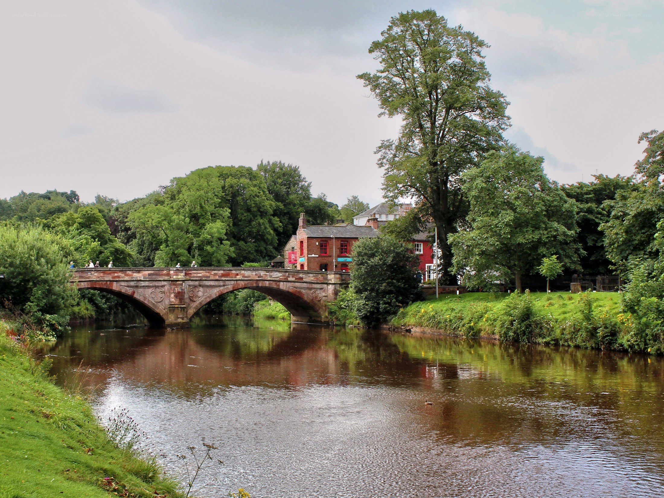 Stone bridge over river in town