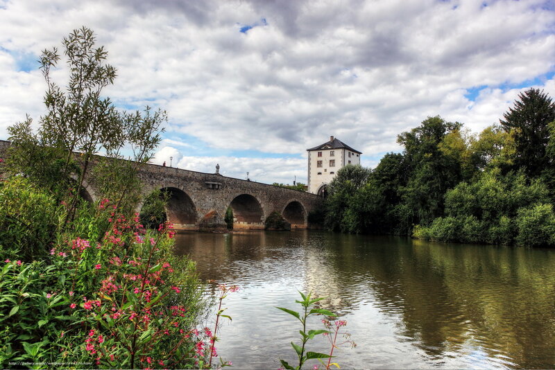 Stone bridge over river with tower