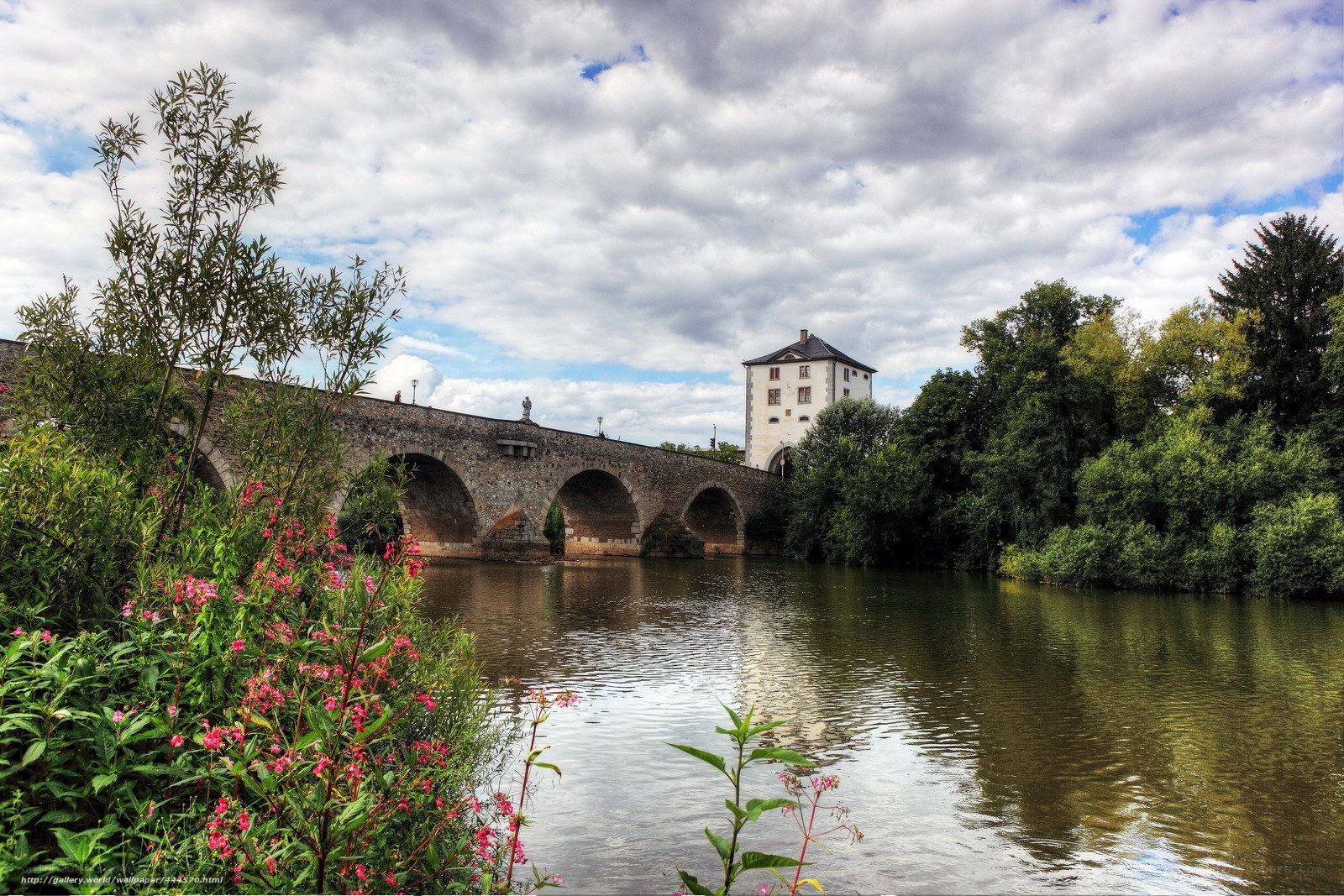 Stone bridge over river with tower
