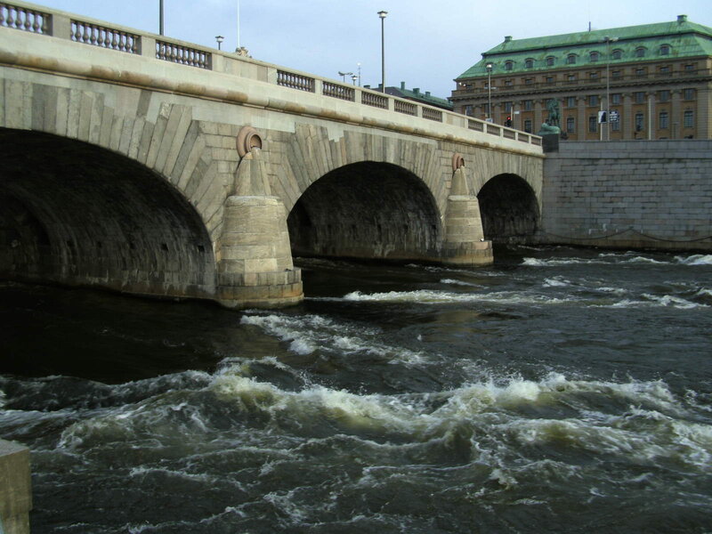 Stone bridge over rushing river