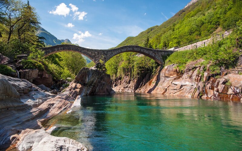 Stone bridge over turquoise river