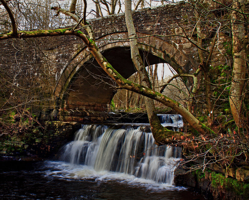 Stone Bridge over Waterfall — Brown