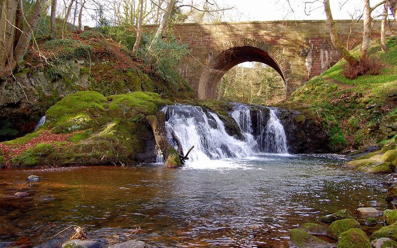 Stone Bridge over Waterfall — Green, Serene, Autumn, Photograph, River, Mossy Rocks
