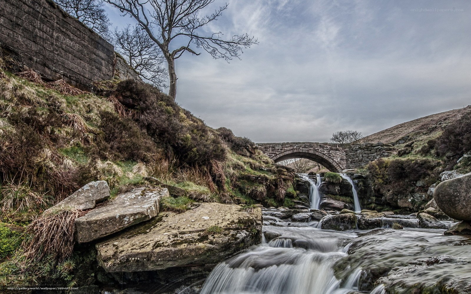 Stone bridge over waterfall