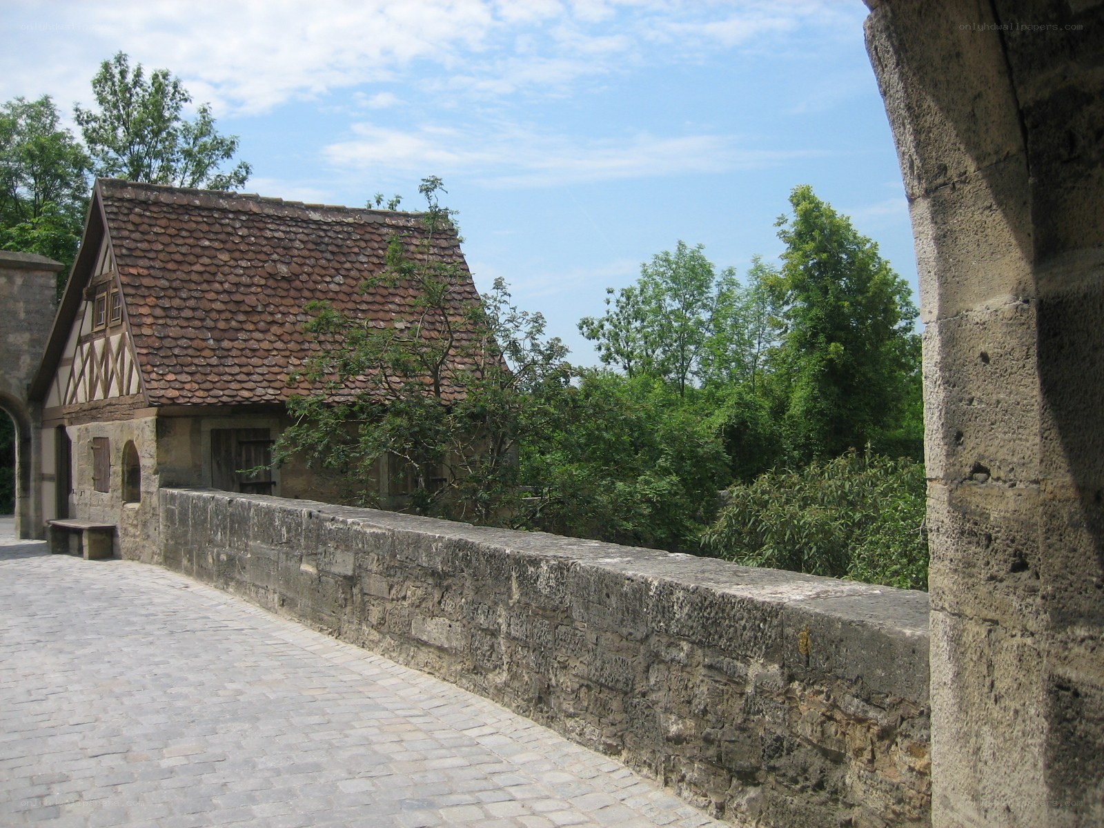 Stone bridge with half-timbered house