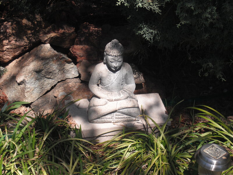 Stone Buddha Statue — Green, Serene, Afternoon