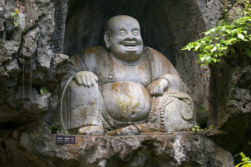 Stone Buddha statue in cave