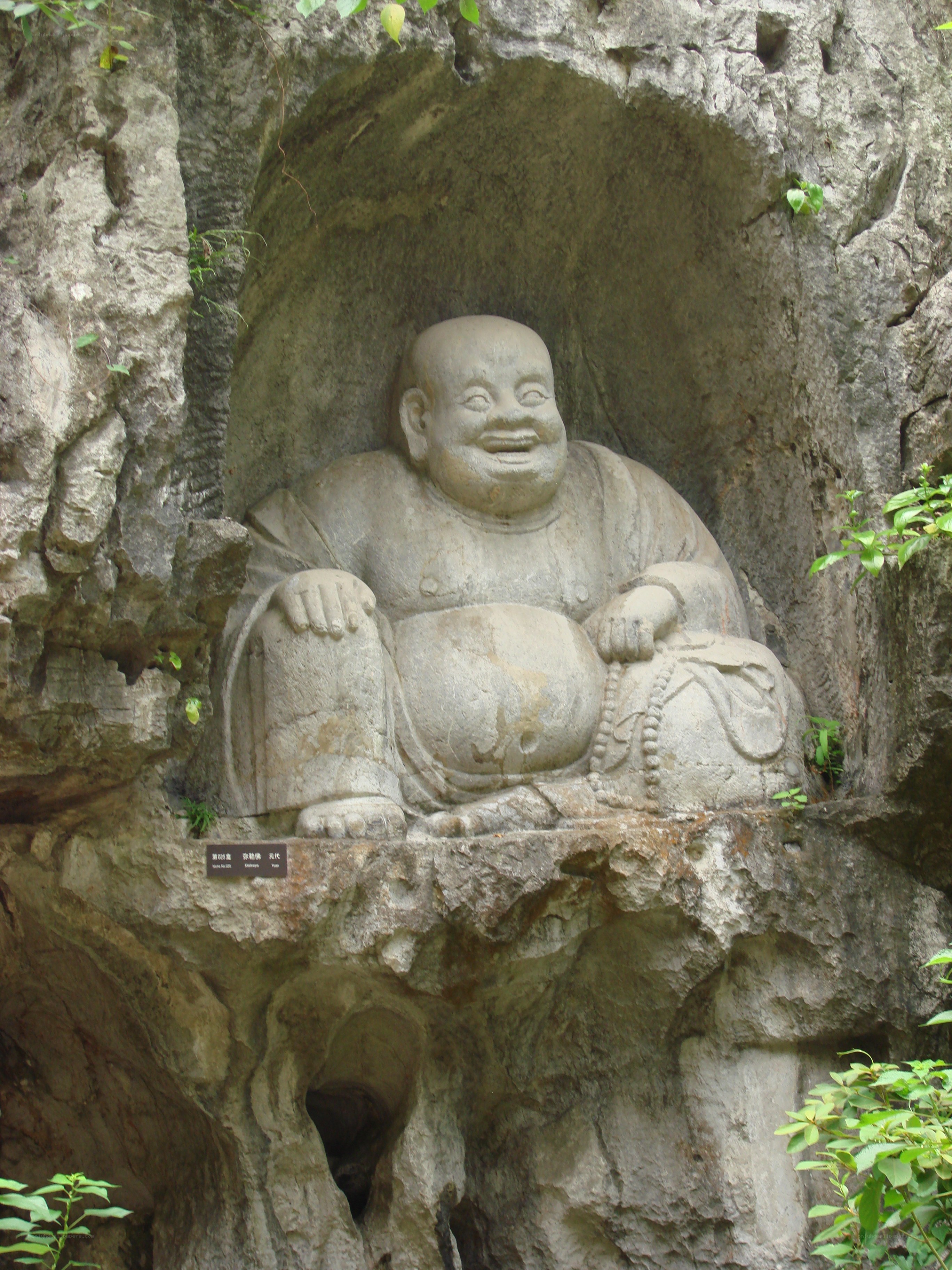Stone Buddha statue in cave