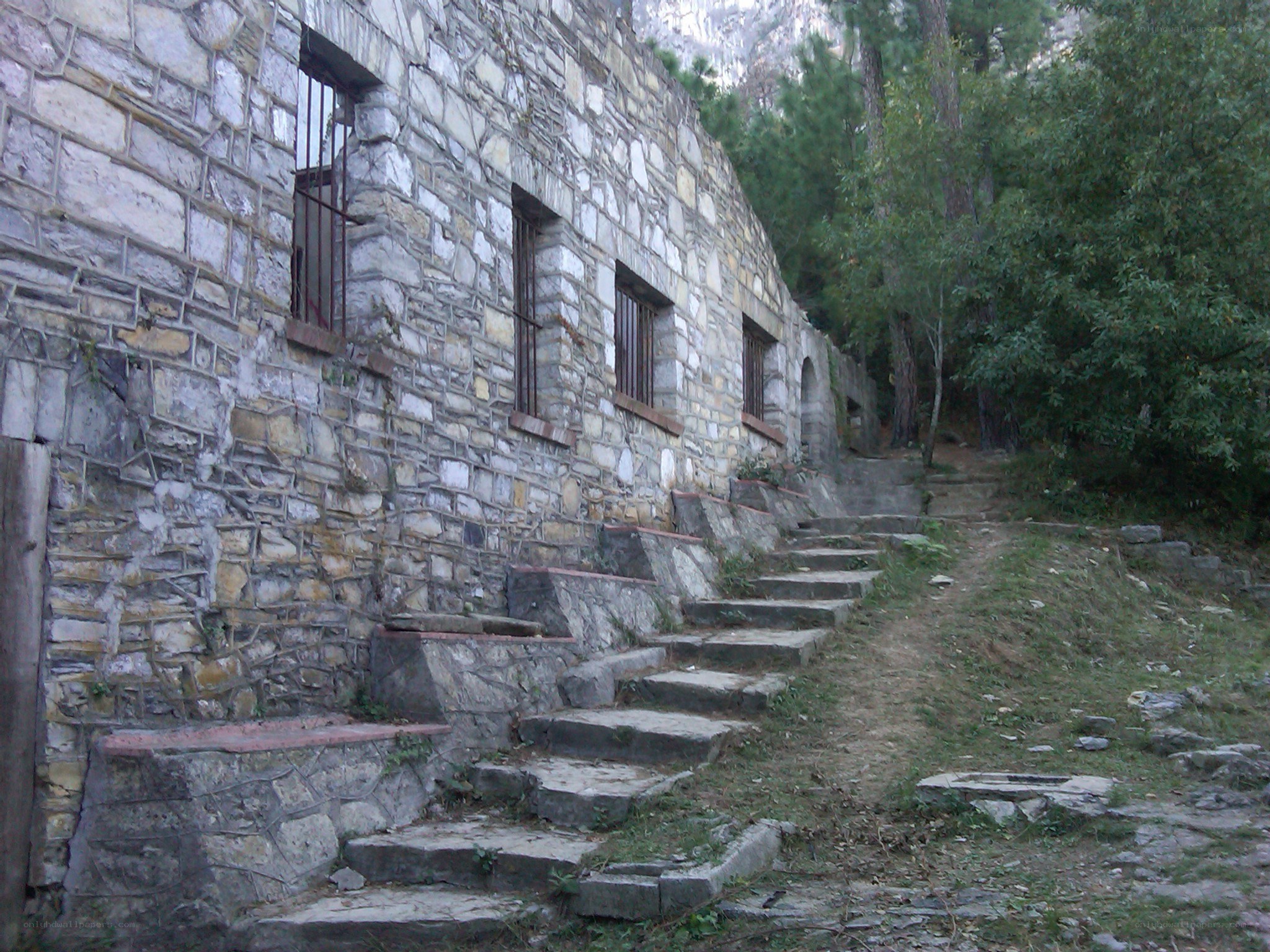 Stone building with barred windows