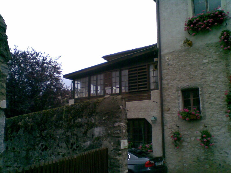 stone building with flower boxes
