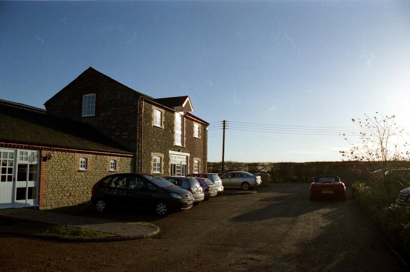 Stone building with parked cars