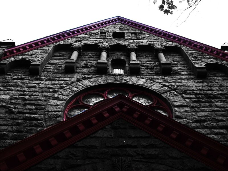 stone building with stained glass