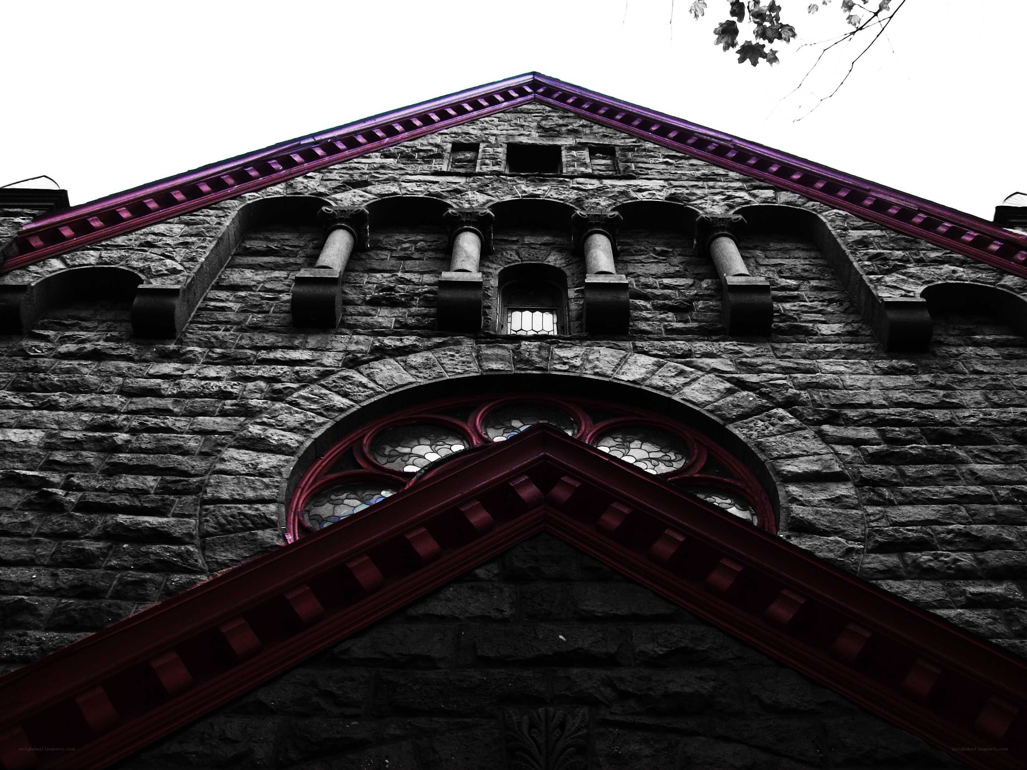 stone building with stained glass