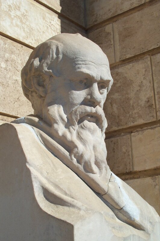 stone bust of a bearded man