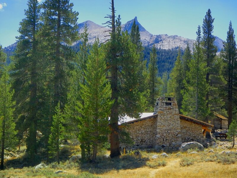 Stone cabin in mountain forest