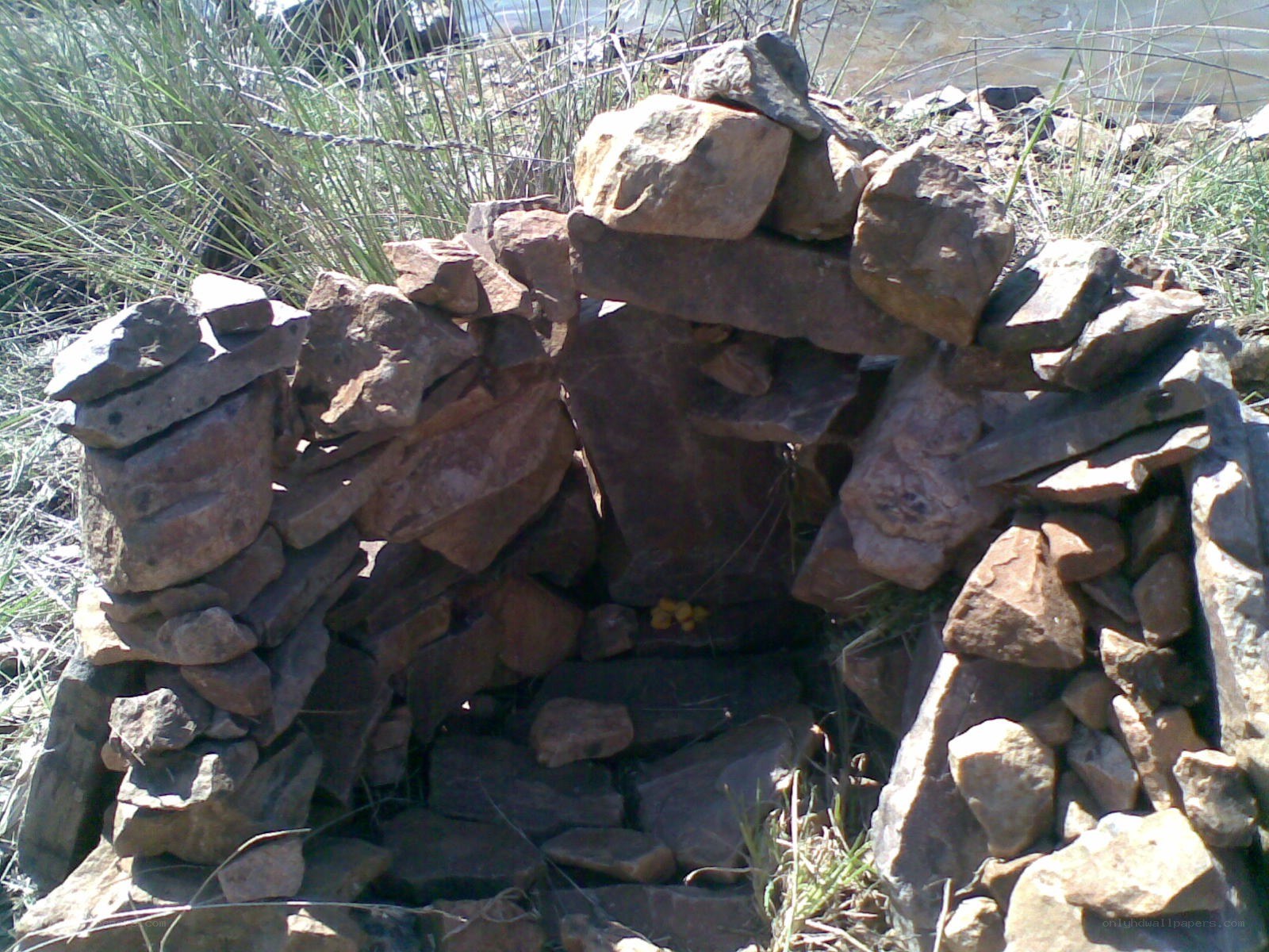 stone cairn by the water