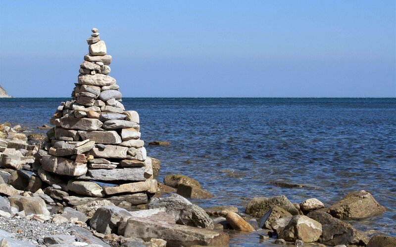 Stone cairn on a rocky shore