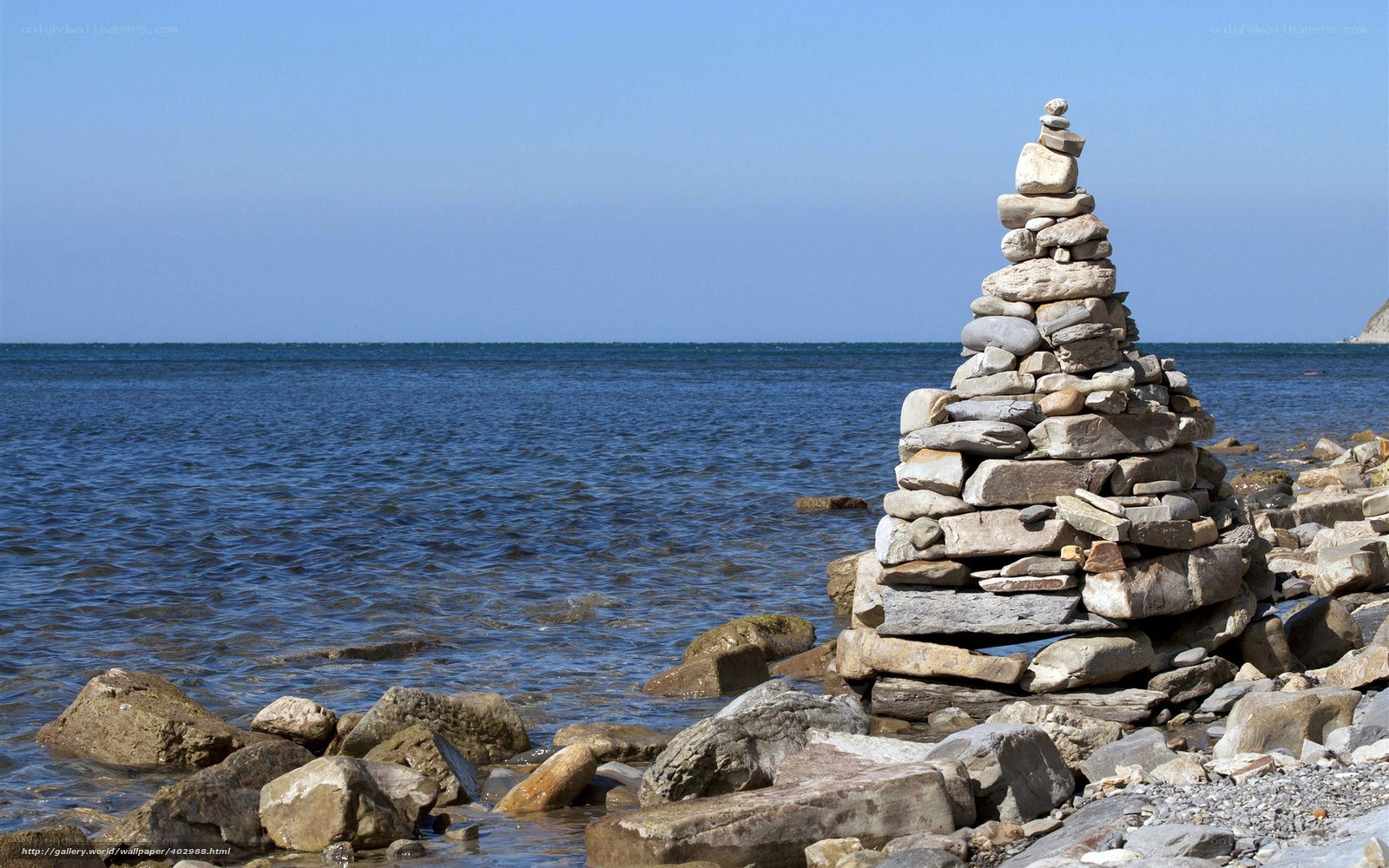 Stone cairn on a rocky shore