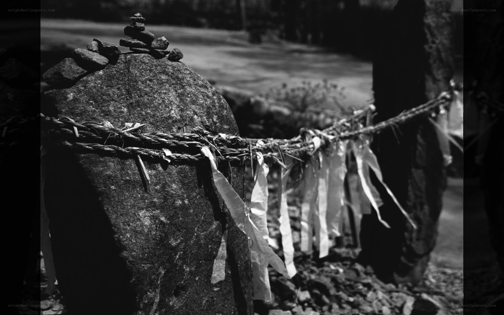 Stone cairn with prayer ribbons