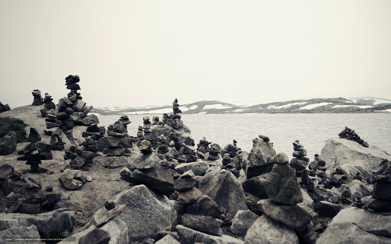 Stone cairns by a lake