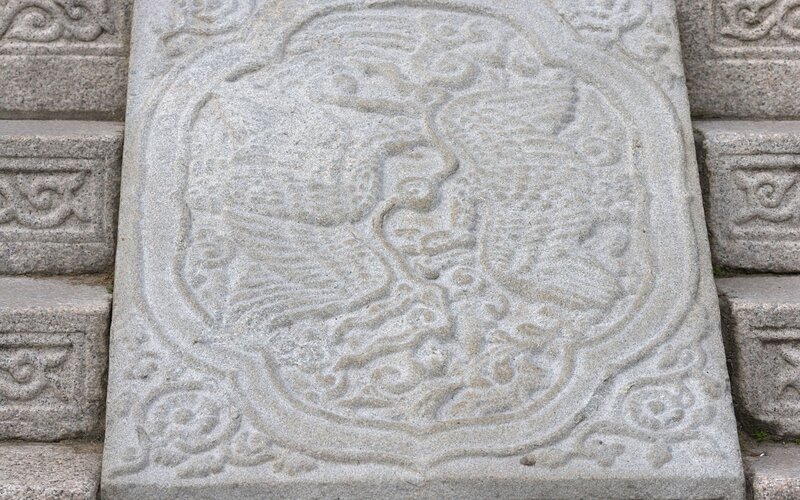 stone carving of a phoenix