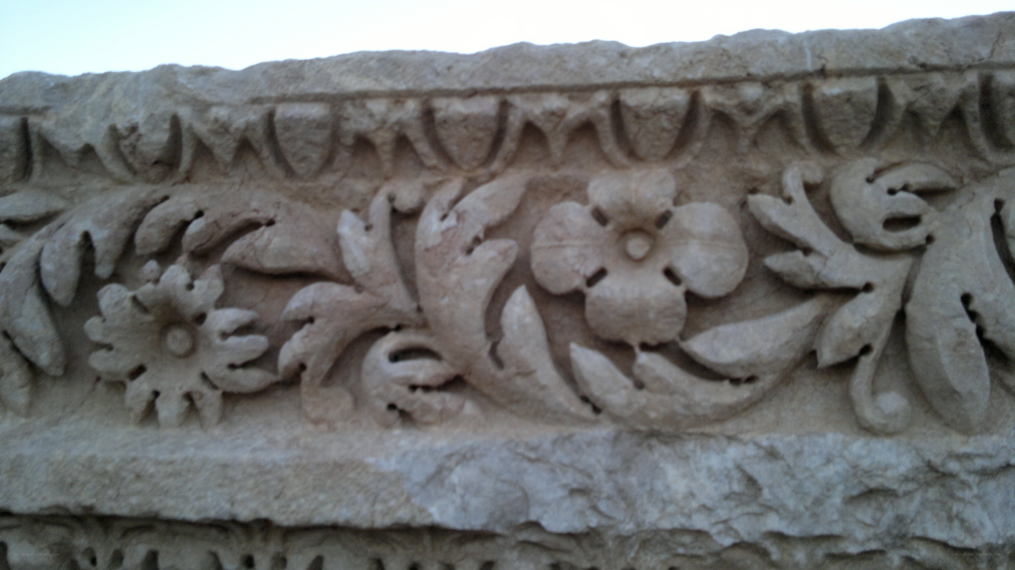 stone carving with floral design