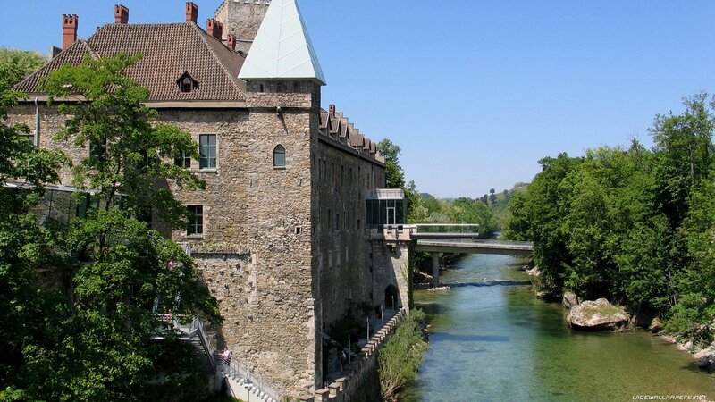 Stone Castle by River — Green, Serene, Afternoon