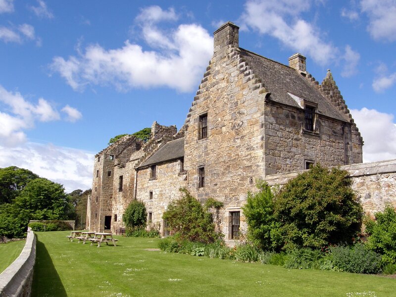 Stone castle in a green garden