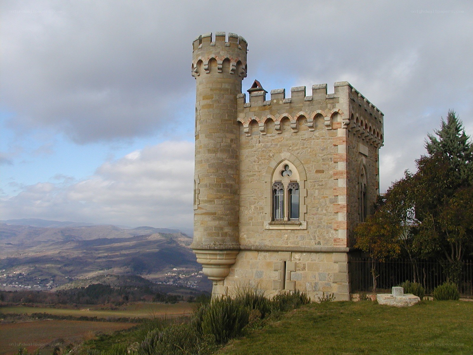 Stone castle tower on a hill