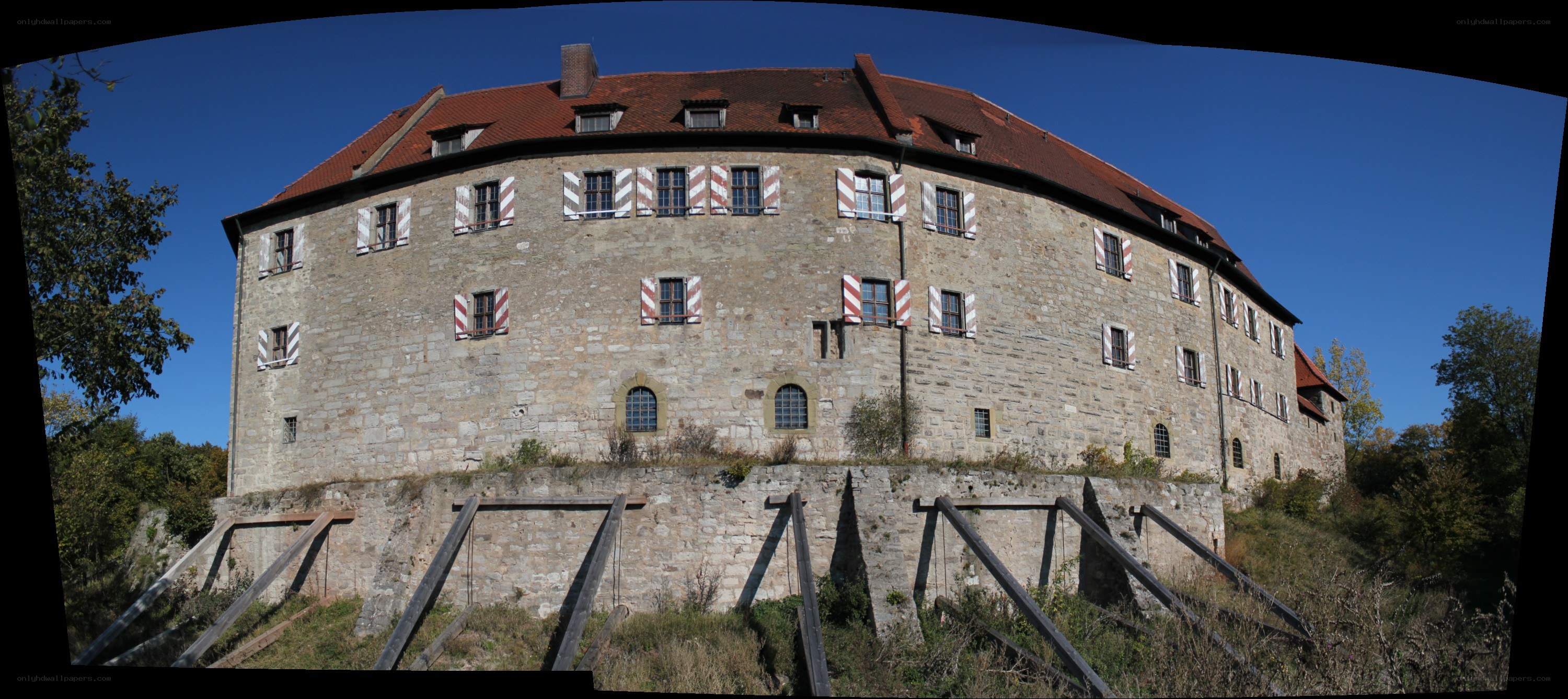 Stone castle with red roof