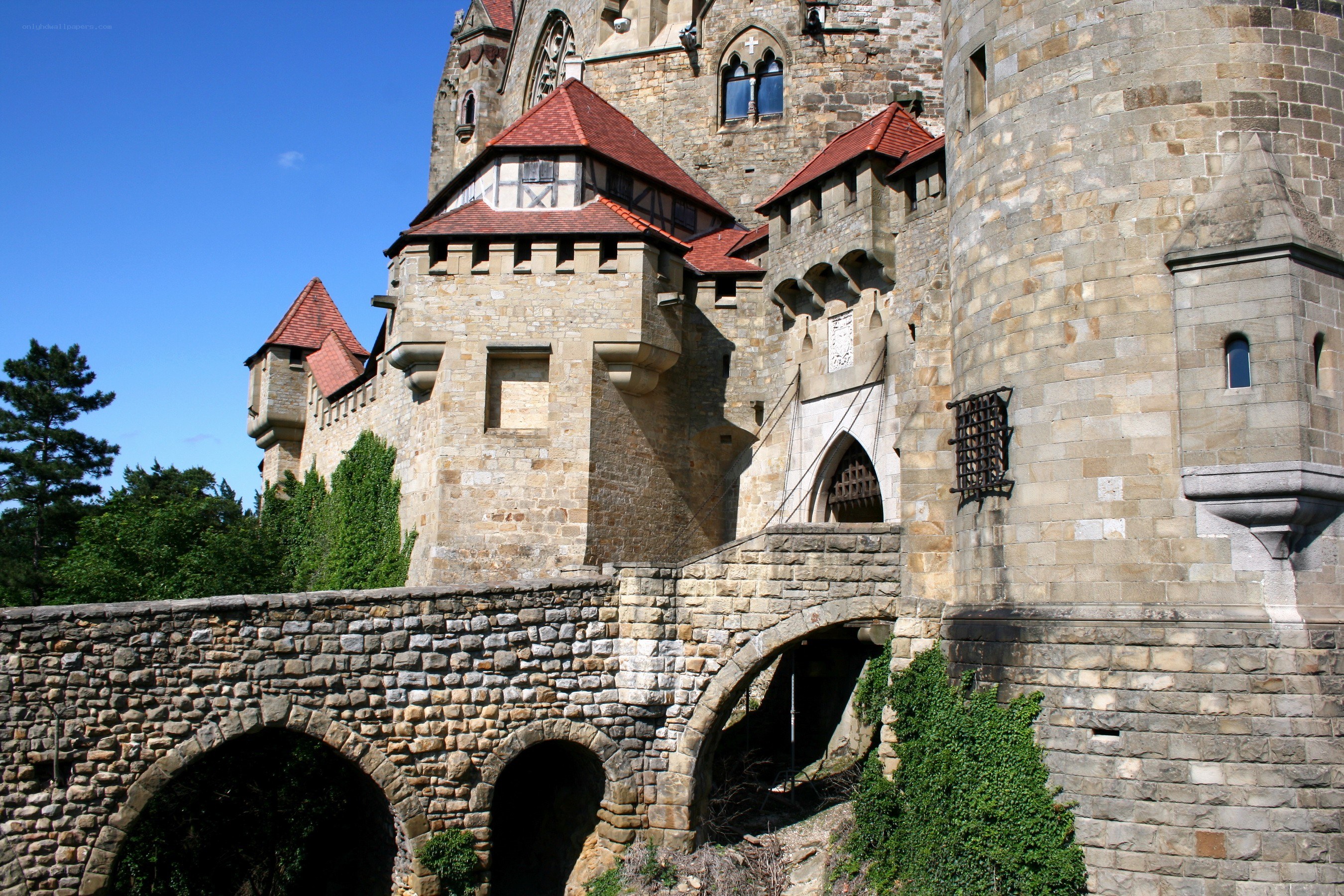 Stone castle with red roofs