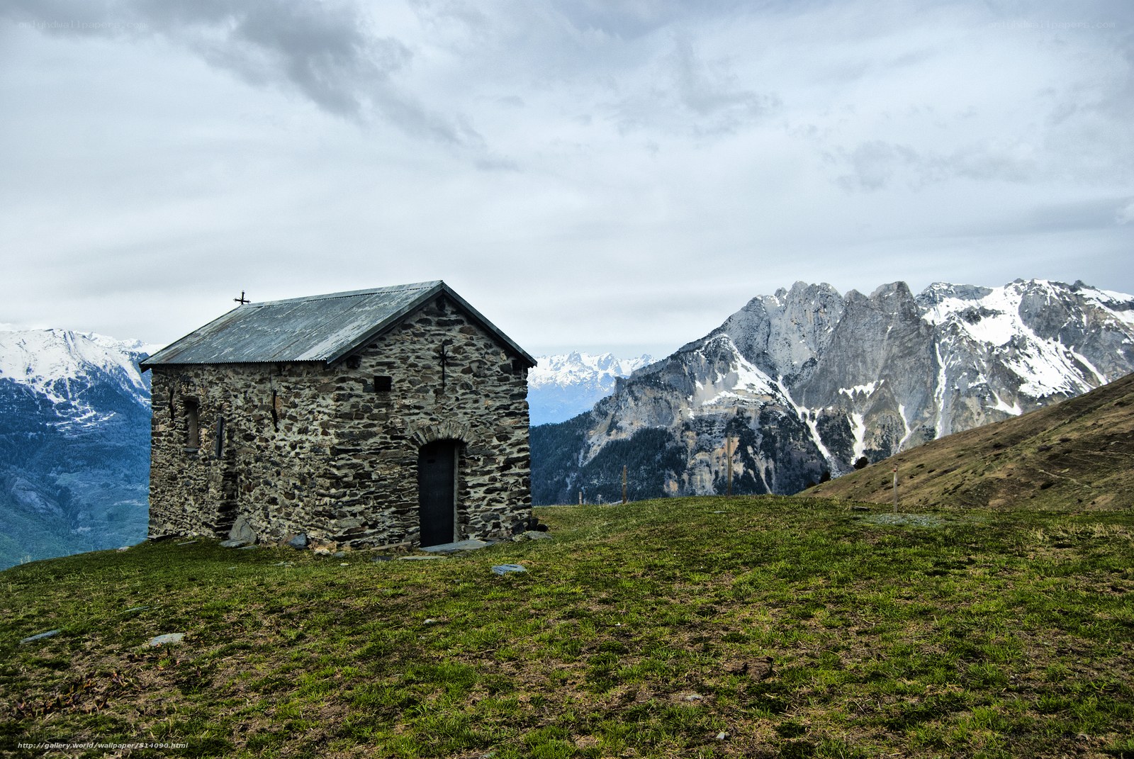 Stone chapel in mountain landscape
