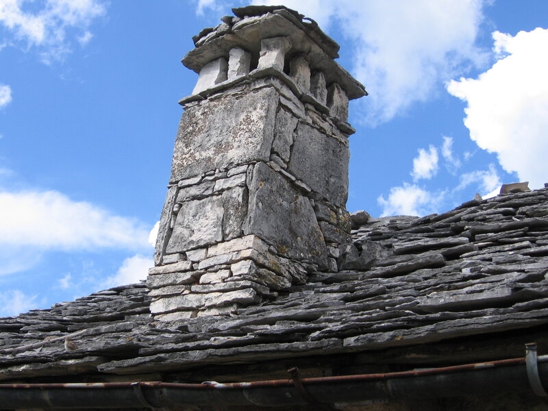 Stone Chimney on Roof — Gray