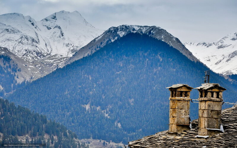Stone chimneys with mountain view