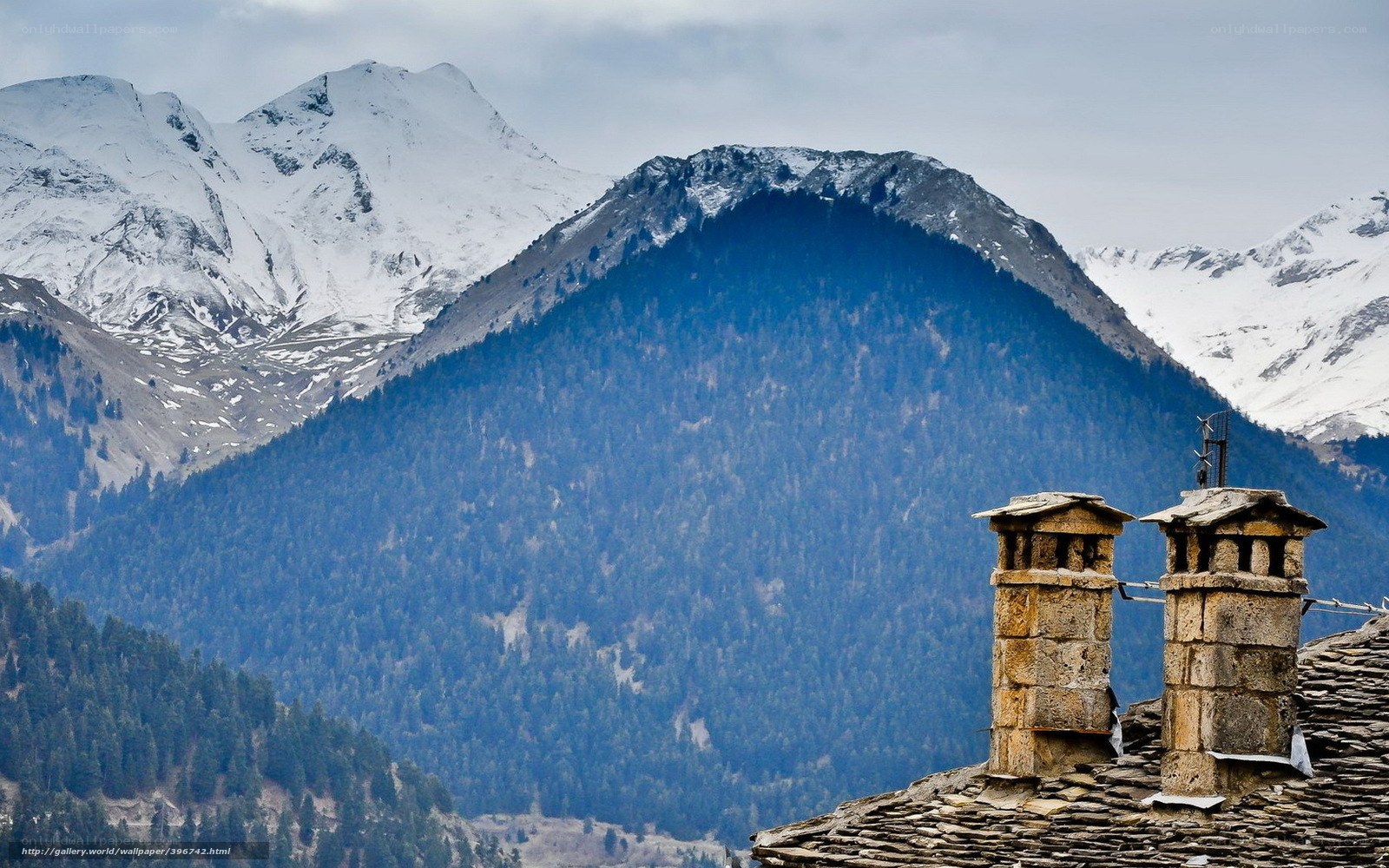 Stone chimneys with mountain view