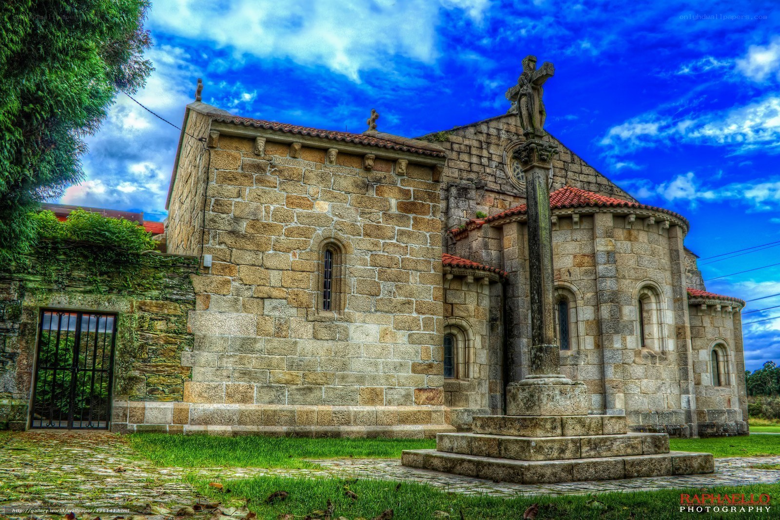 Stone church with cross monument