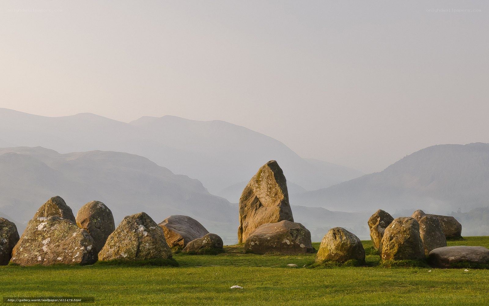 Stone circle in a misty valley