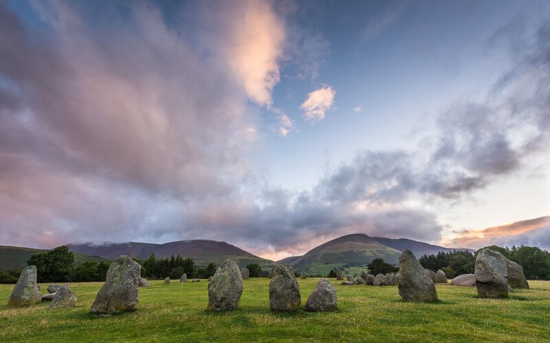 Stone Circle in Field — Green, Dramatic, Sunset, Photograph, Mountains
