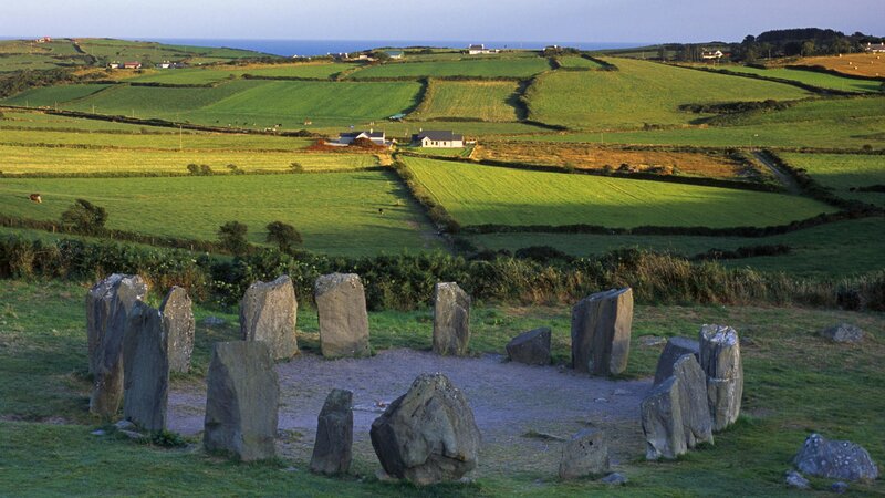 Stone Circle in Field — Green, Serene, Afternoon, Photograph, Fields, Houses