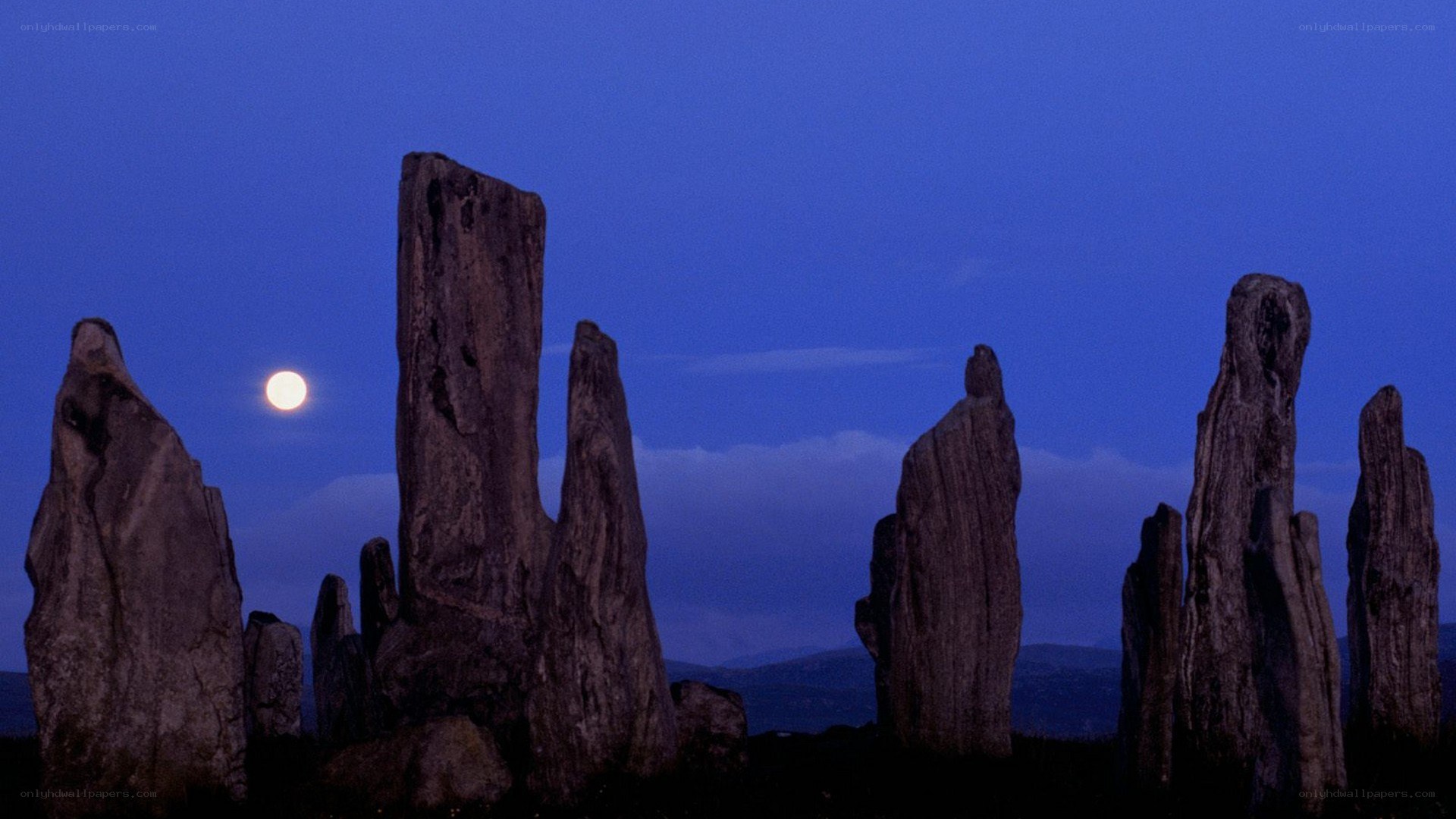 Stone circle under moonlight