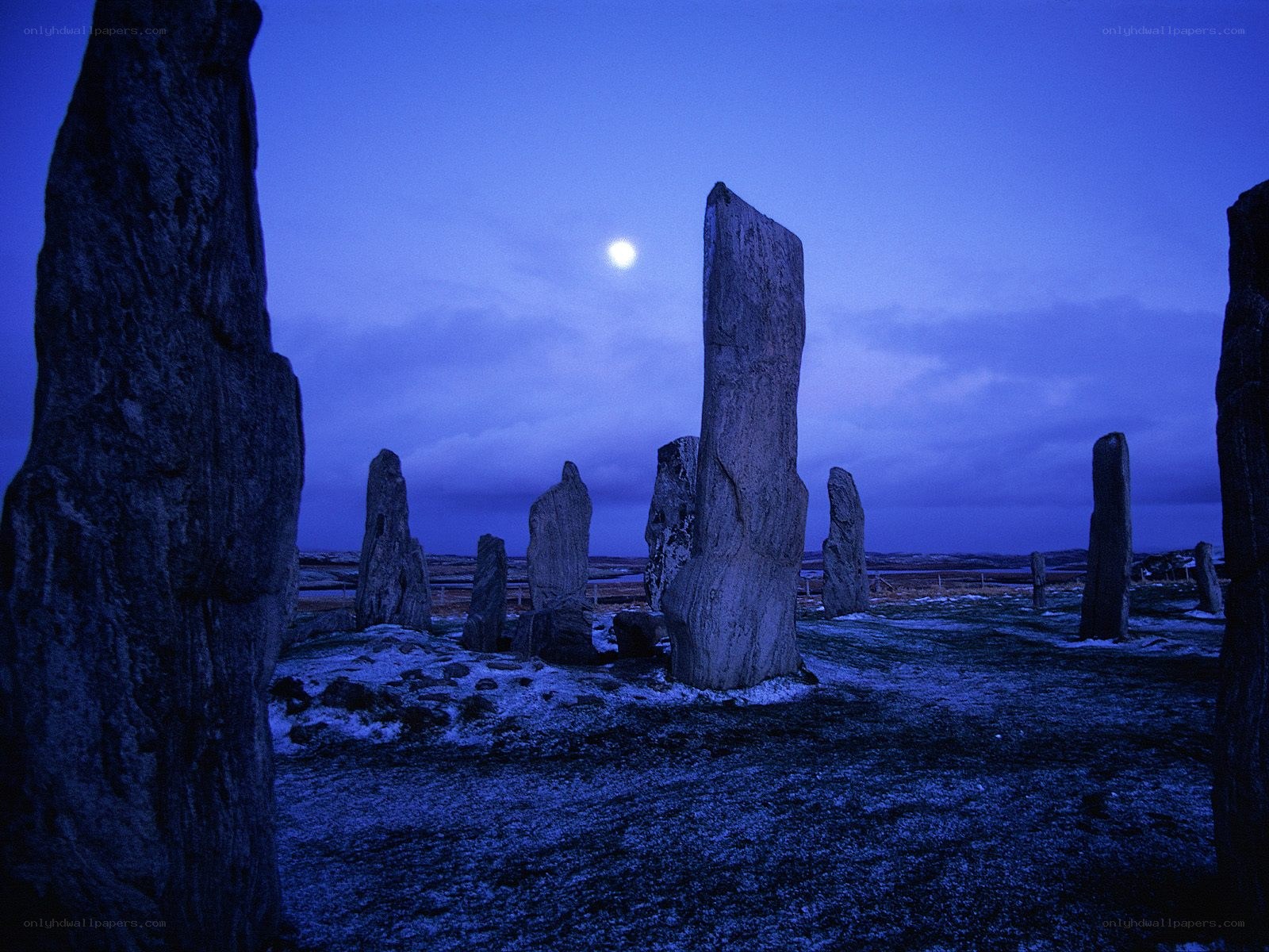 Stone circle under moonlight