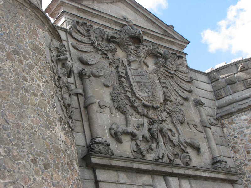 stone coat of arms on building